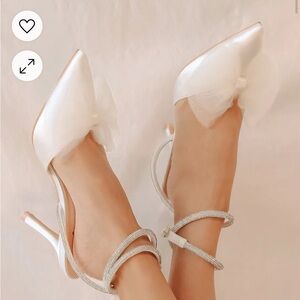 Lulu’s LeLanee white satin rhinestone tone bow ankle strap pumps
